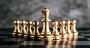 Gold Chess on chess board game for business metaphor leadership
